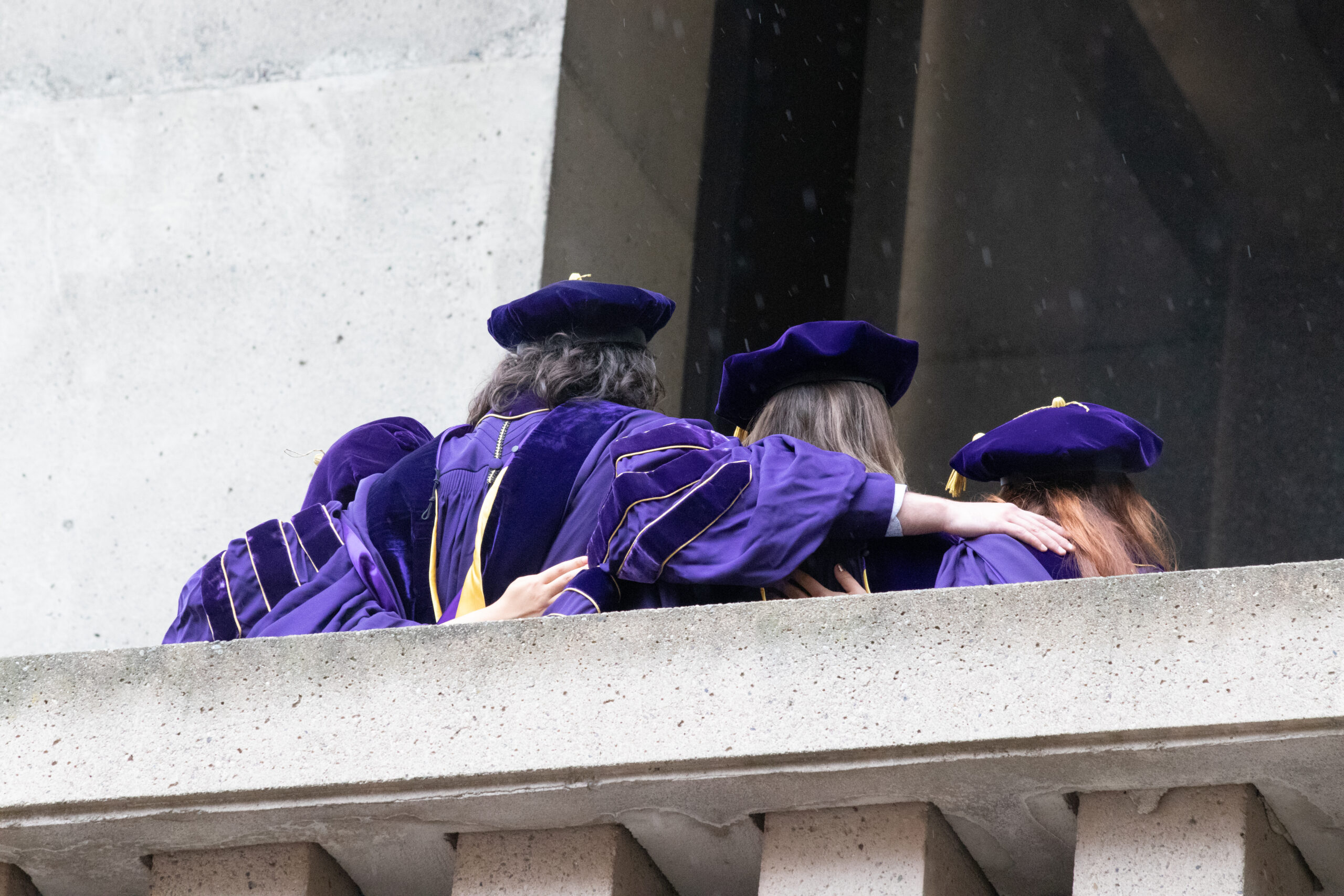 Graduates walking together on the UW campus