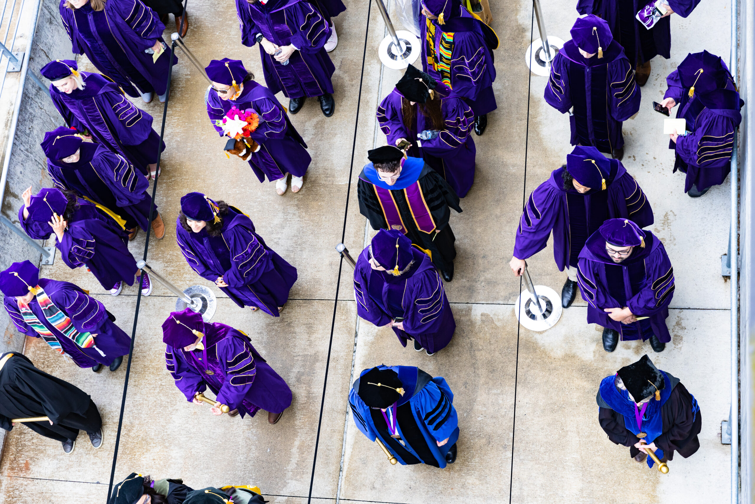 Graduates in purple regalia seen from above